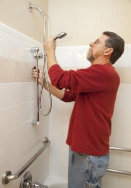 Jim is fixing a broken shower head